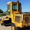 An asphalt sweeper.