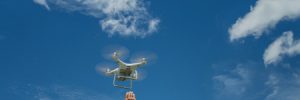 man releasing drone for construction data