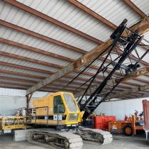 A crawler crane in a warehouse.
