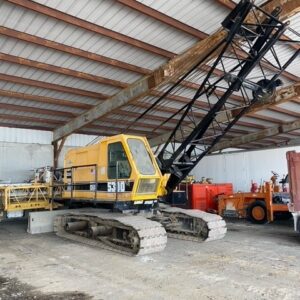 A crawler crane in a warehouse.