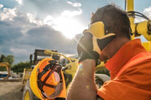 Heavy Machinery Operator observing proper safety techniques.