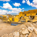 Heavy and mobile machinery in a quarry to transform stone into construction material