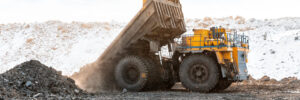 Large quarry dump truck. Loading the rock in the dumper. Loading coal into body work truck. Mining truck mining machinery, to transport coal from open-pit as the Coal. Production useful minerals.