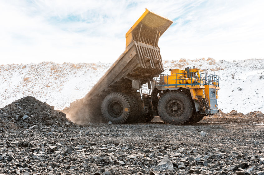 Large quarry dump truck. Loading the rock in the dumper. Loading coal into body work truck. Mining truck mining machinery, to transport coal from open-pit as the Coal. Production useful minerals.